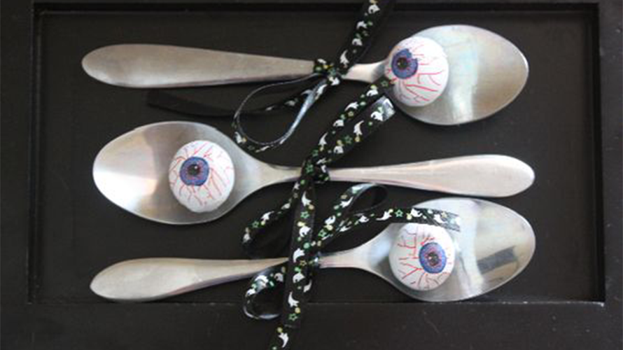 Pretend eyeballs on spoons are part of a Halloween games for kids relay