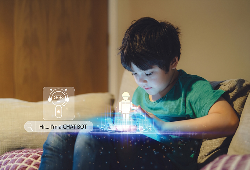 Boy sitting on a couch with projections of a chatbot on his lap
