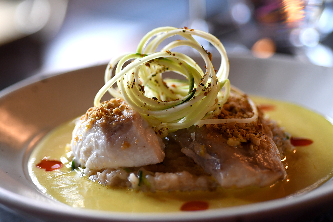 Best Asian restaurants in Seattle include Rasai Indian food halibut moilee dish artfully presented