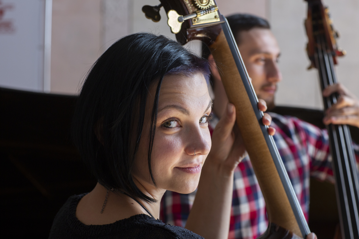 Young woman playing a double bass