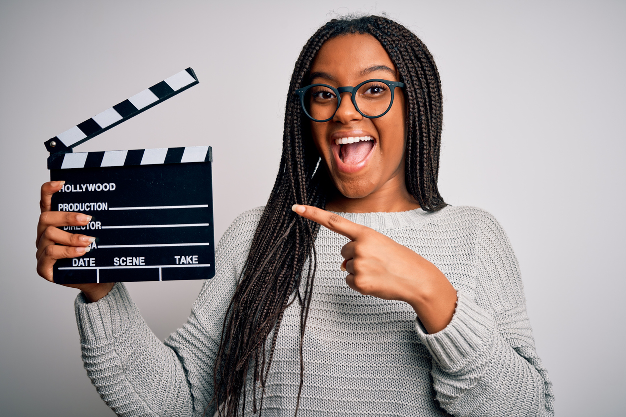Young African American woman holding a scene marker