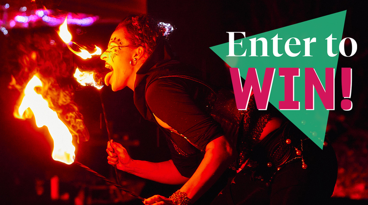"Enter to Win!" Text over fire performer at festival