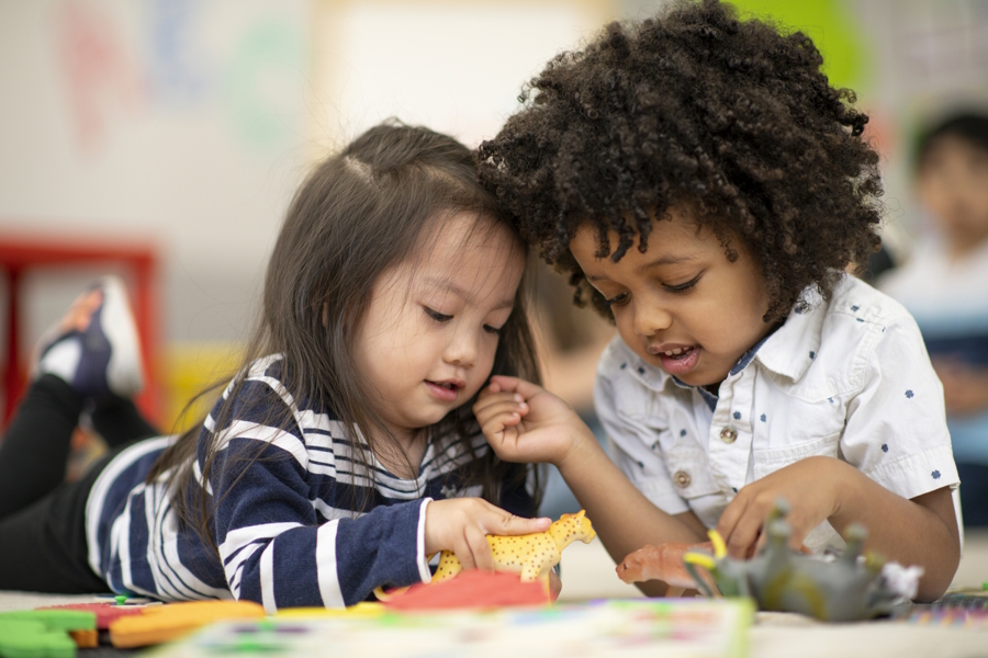 Two children engaged in independent and imaginative play