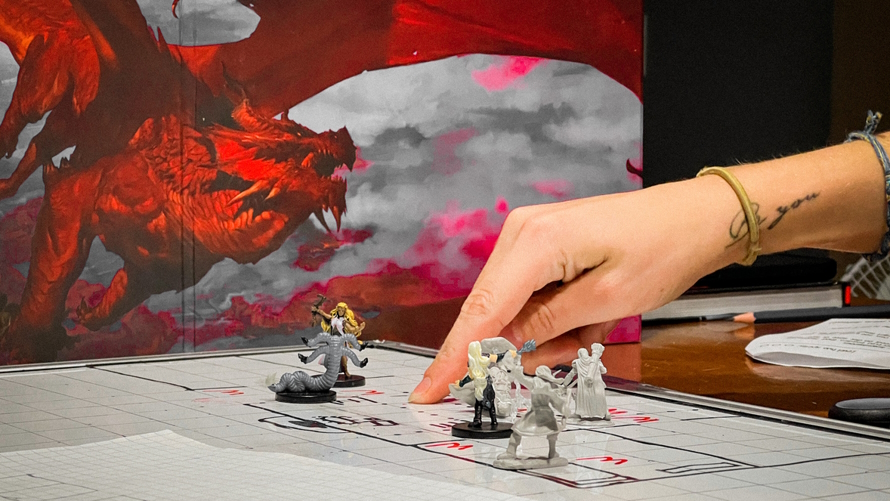D and D board with a picture of a dragon in the background