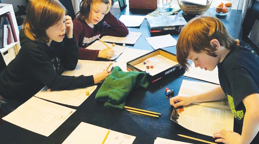 Three tween boys playing D&D