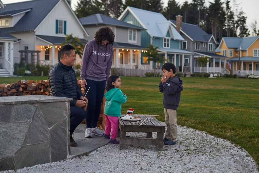 Mom, dad, son and daughter roasting s'mores at Seabrook