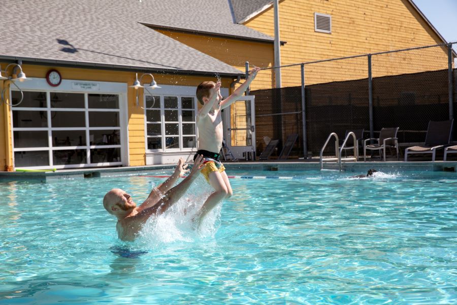 Father and son playing in a pool at Semiahmoo Resort