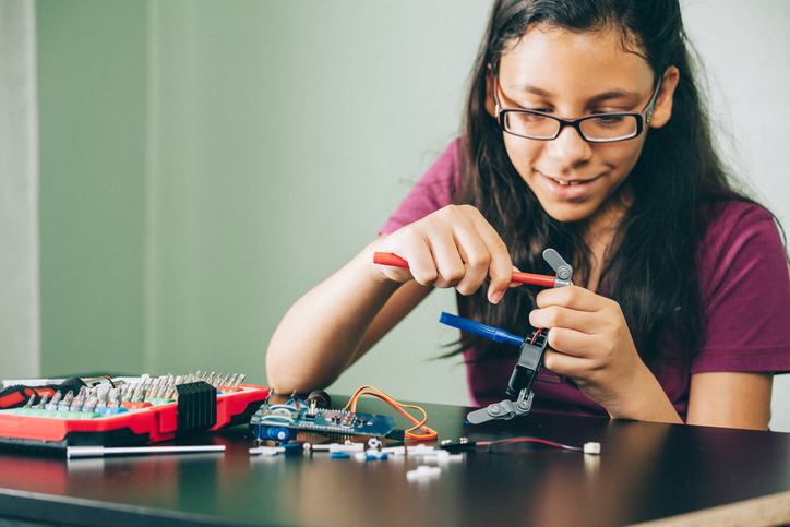 a child explores building with electronics while growing her sense of self