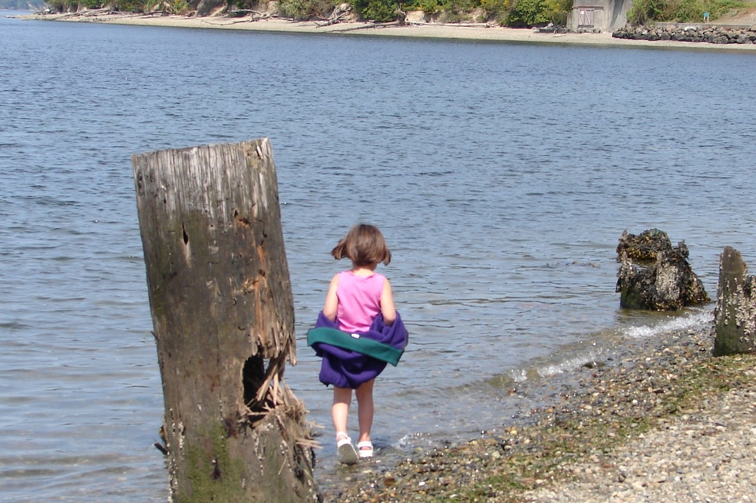 Titlow beach park Tacoma girl wading after enjoying lunch at a picnic spot in Seattle