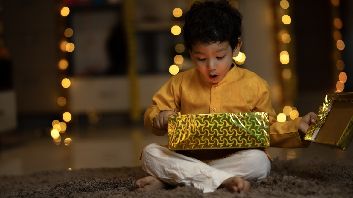 Child opening the perfect holiday gift