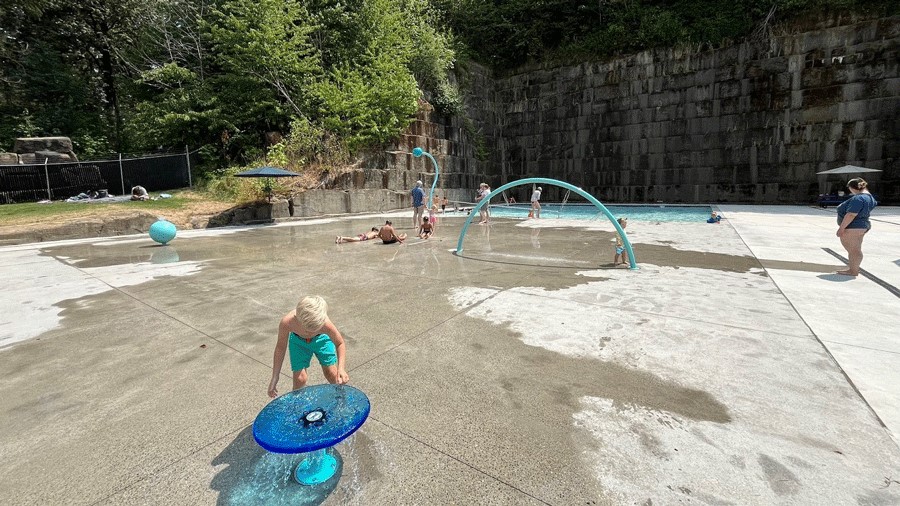 The kids area at Tenino Pool Quarry includes a splash pad, wading pool and water features