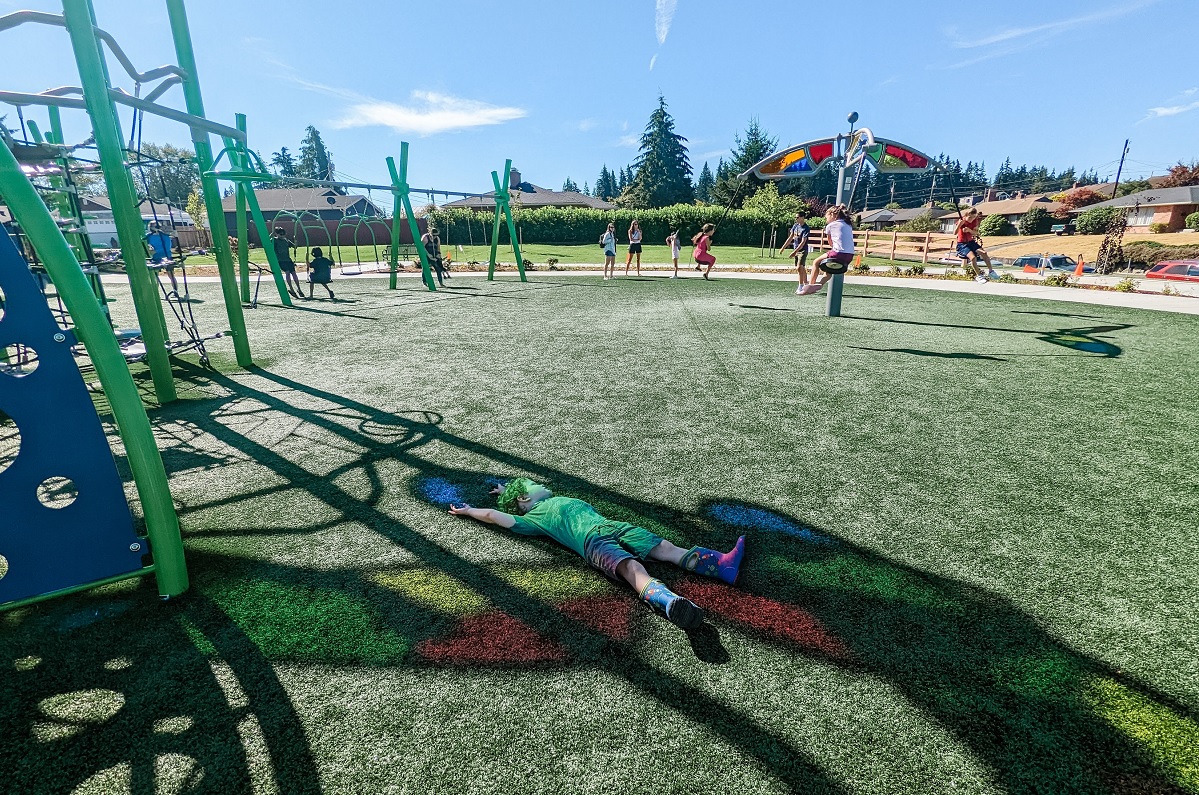 Rainbow light on the turf at Emma Yule Park playground