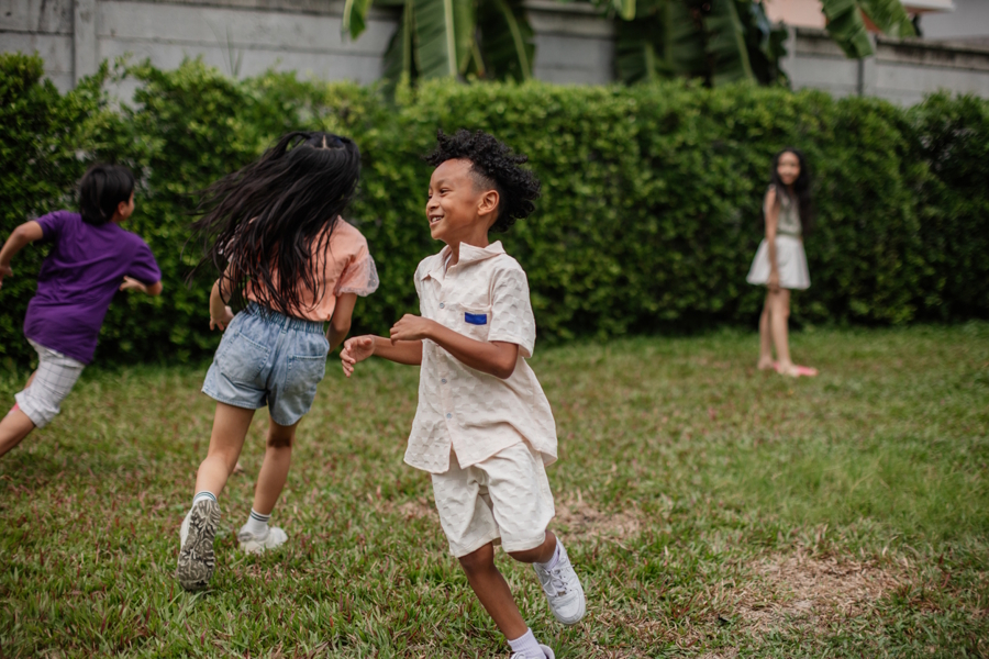 kids running around backyard camping