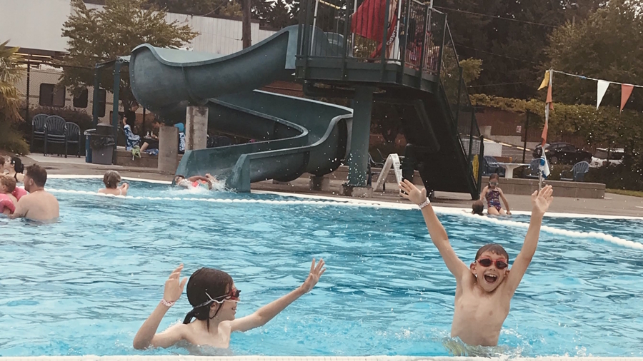 Two boys playing in Mounger pool
