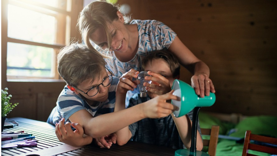 Mother and Kids Replace Lightbulb