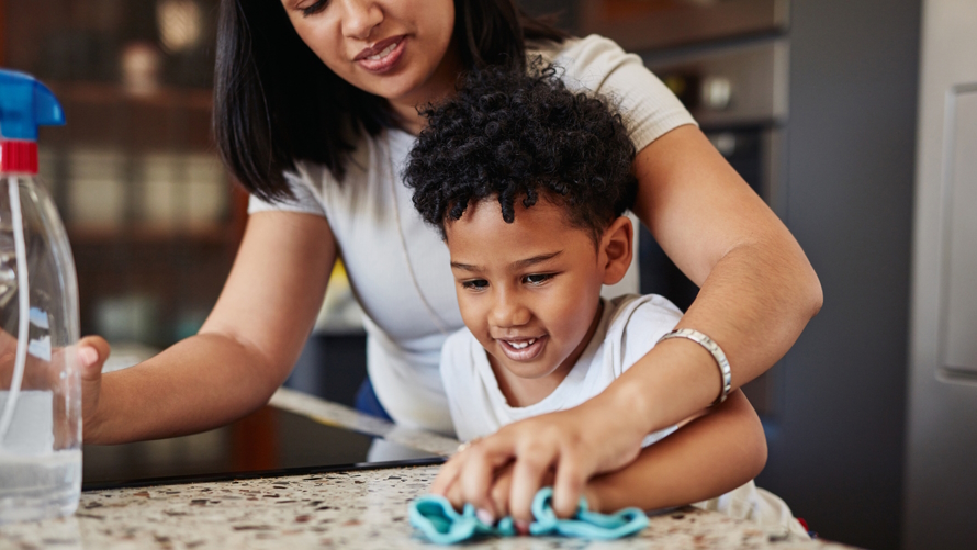 Mom and son cleaning counters with eco-friendly cleaning products