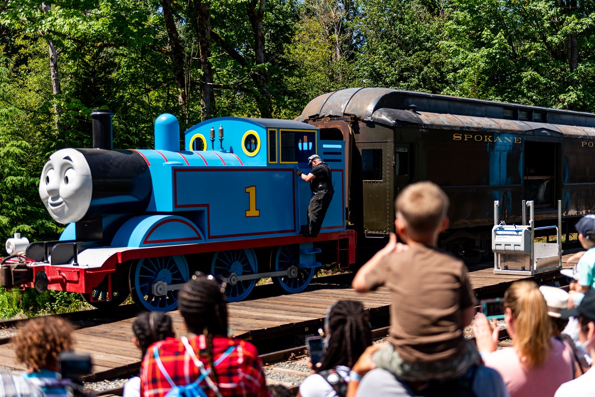 A life-size Thomas the Tank Engine pulls a train car at the Day Out With Thomas event near Seattle at the Northwest Railway Museum in Snoqualmie, Washington