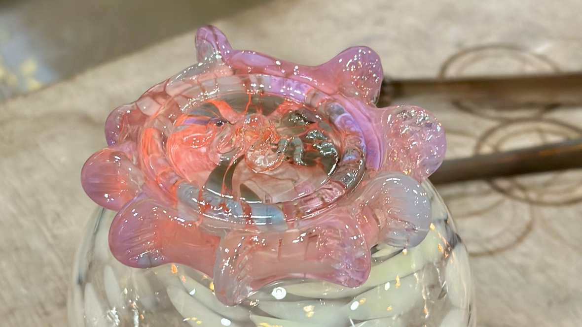 a monkeyshine cooling off over a glass of ice water