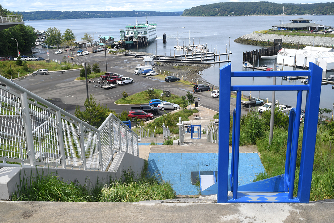 A view looking down along the slides and stairs of Point Defiance Park's Dune Peninsula life-size chutes and ladders-style fun.
