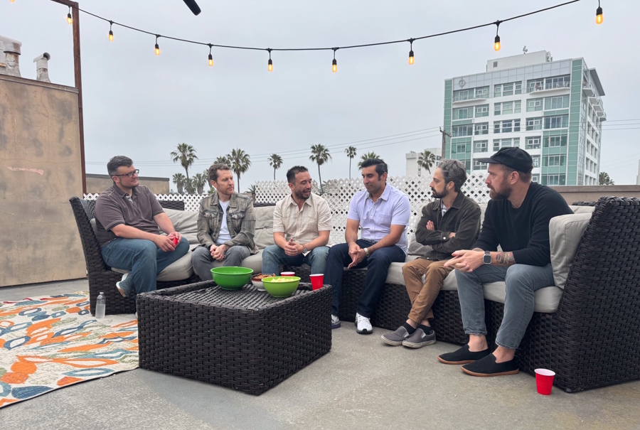 men sitting on an outdoor couch at a roundtable conversation in LA