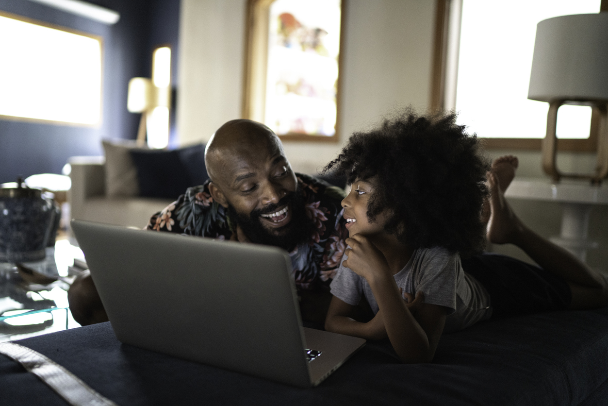 dad and daughter explore the internet together