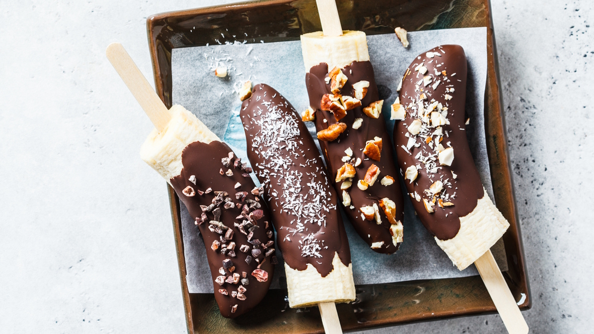 Frozen bananas dipped in chocolate and nuts are a great summertime treat