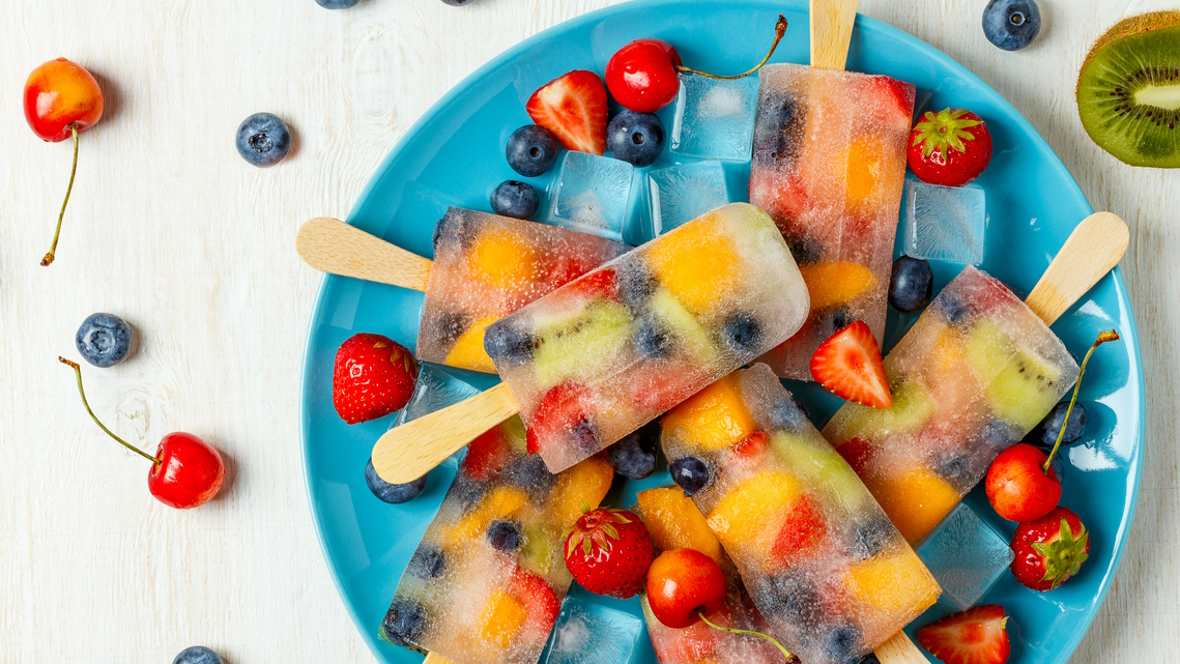 Fruit popsicles on a blue plate