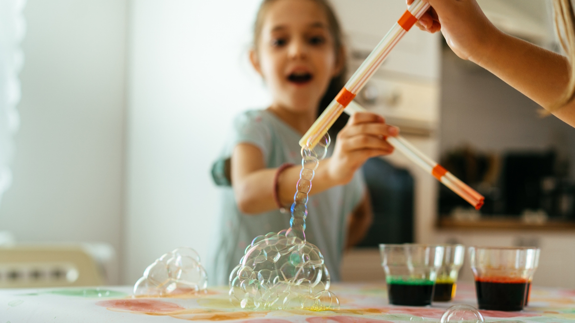 child painting with bubbles and straws messy art projects