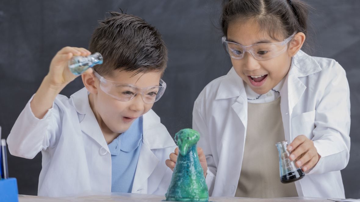two kid in lab coats excited to watch a jar bubble over will love this outdoor messy art project