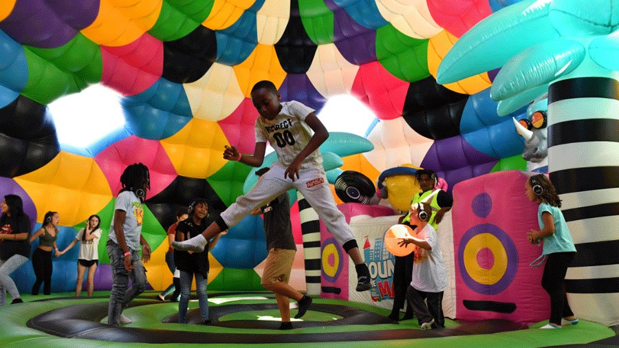Kids jumping in an inflatable Disco Dome at Bounce The City Seattle