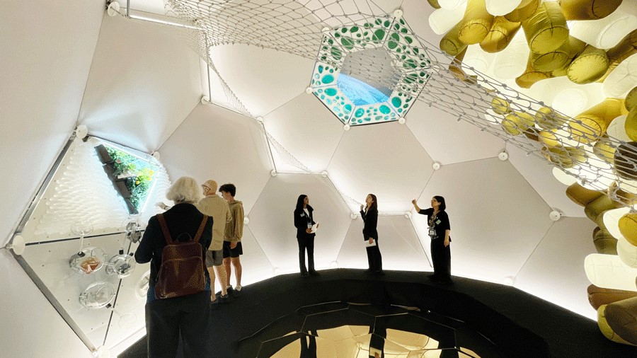 Museum visitors inside the TESSERAE Space Habitat Pavilion at The Museum of Flight in Seattle