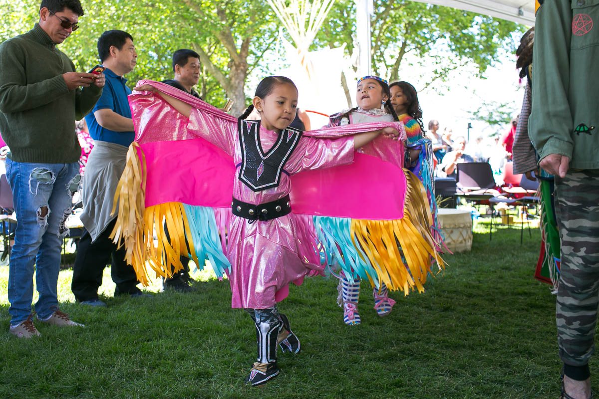 A young Native American girl dances during the Circle of Indigenous People celebration at a past Northwest Folklife Festival