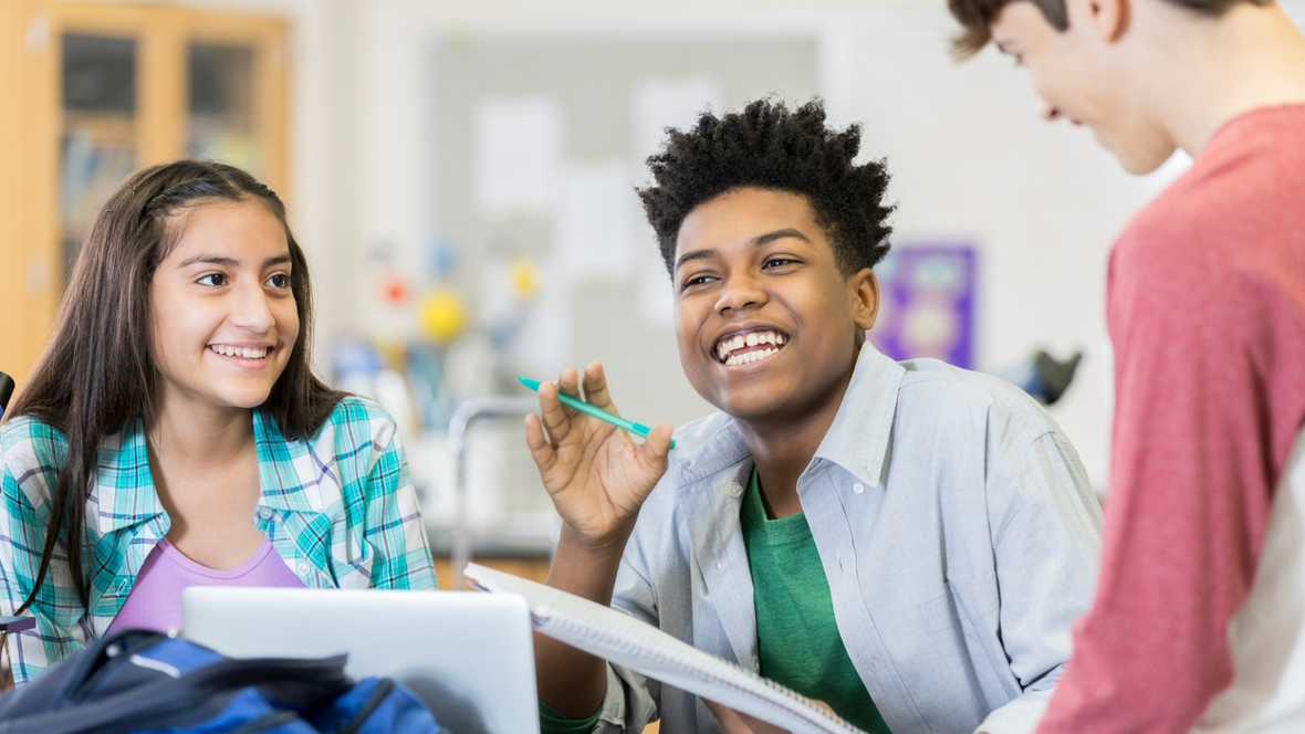 Students in a classroom working and engaging together with no cell phones