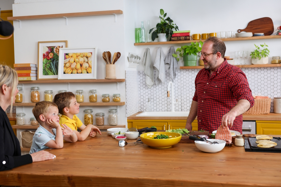 Joel and his children in the kitchen