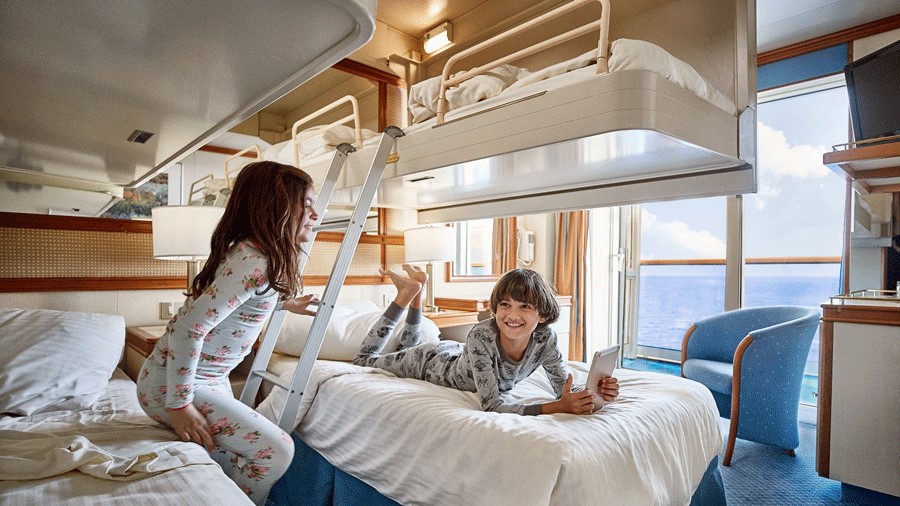 Kids bunk beds pull down from the ceiling in a Princess Cruise state room