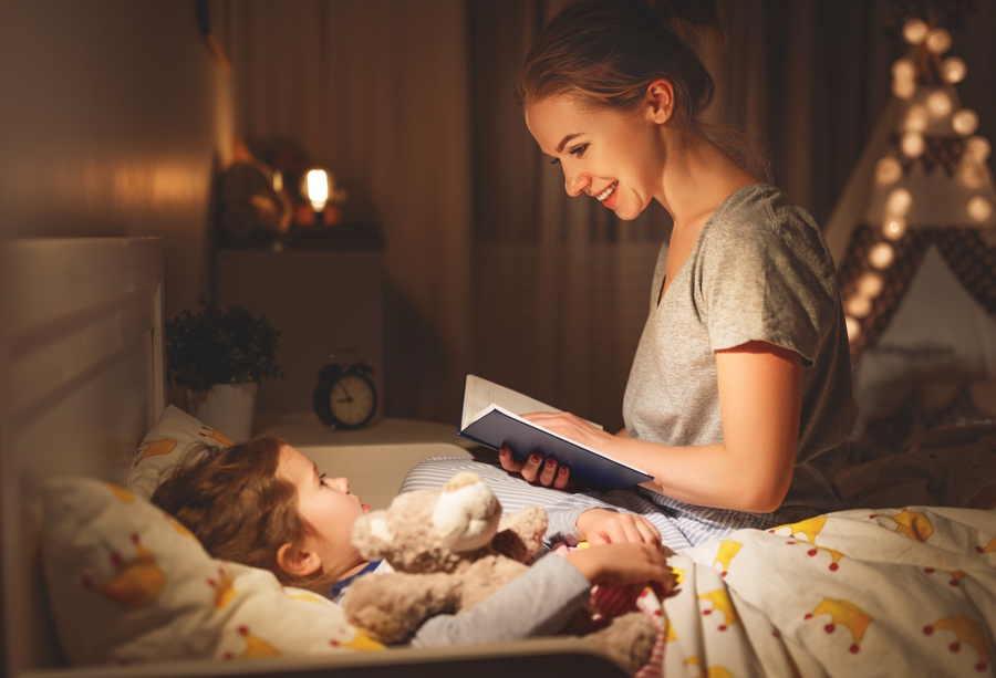 mom reading to a child at bed time