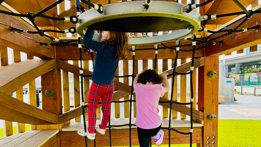 two girls playing at Melanie's Park in Tacoma