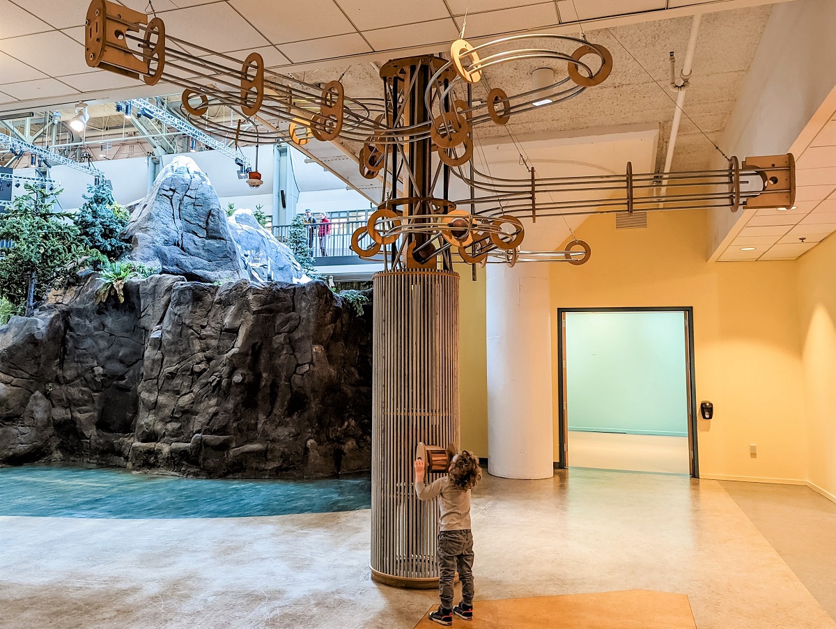 Boy looking up at tower at recently reopened Seattle Children's Museum at Seattle Center