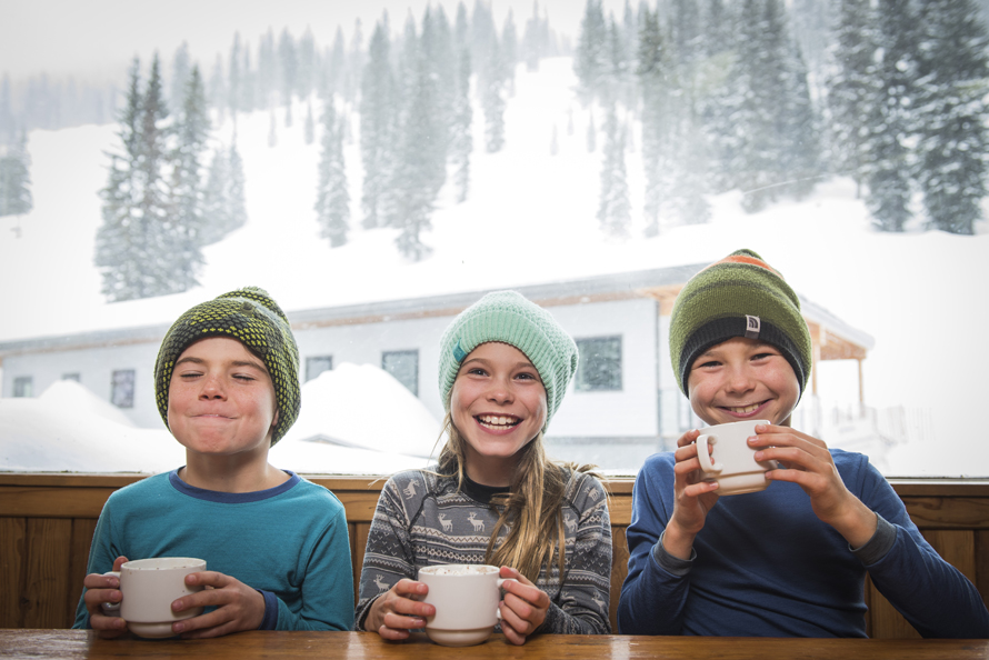 kids sipping hot chocolate at whitewater resort