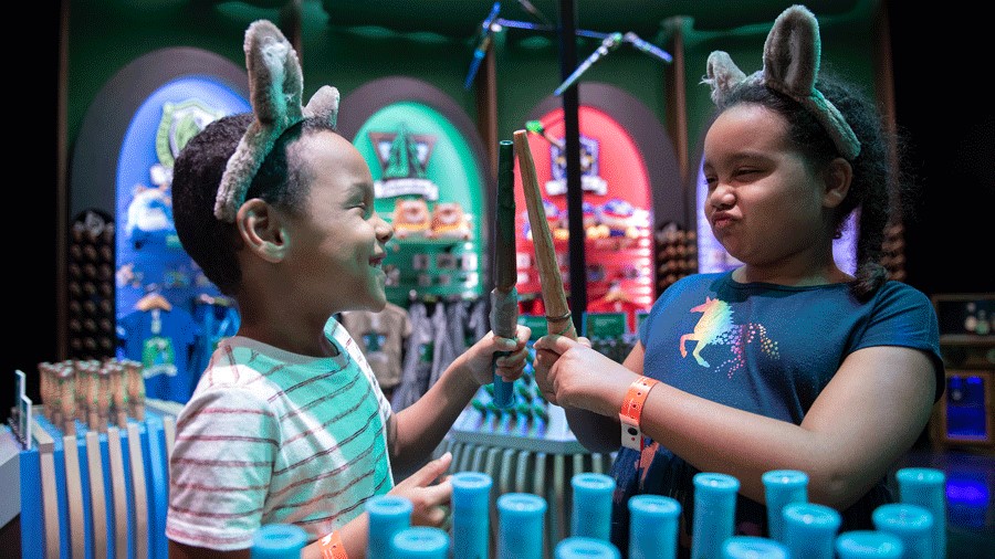 Great Wolf Lodge Water Park kids with MagicQuest wands and wolf ears play