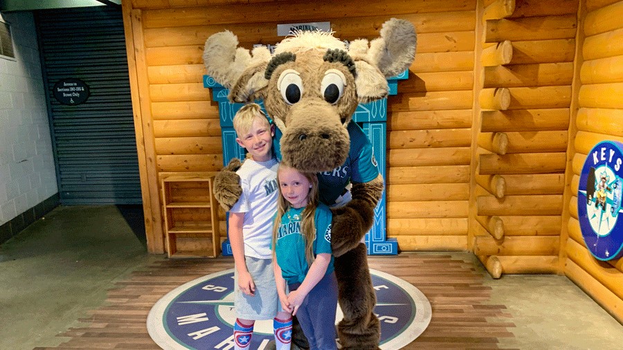 Two kids with the Mariner Moose at T-Mobile Park
