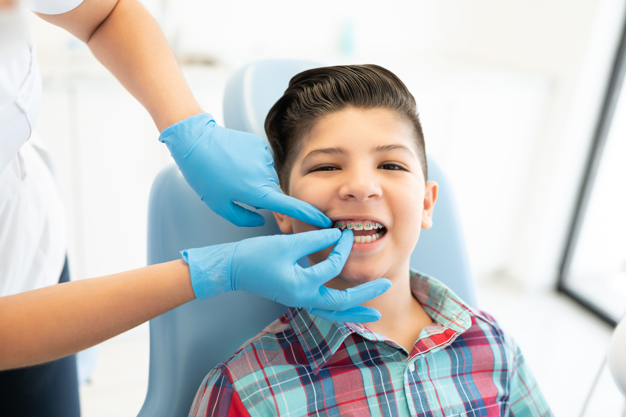 boy with braces at the orthodontist