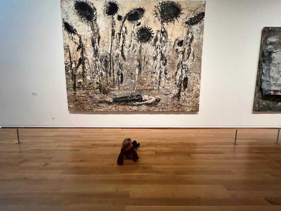 baby in front of art