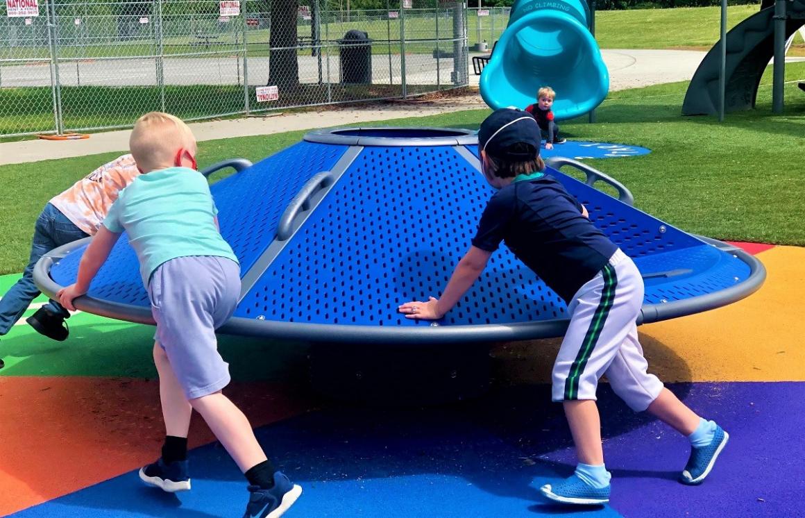 West Fenwick Park Slides and Climbers game spinner merry-go-round kids playing new playground near Seattle