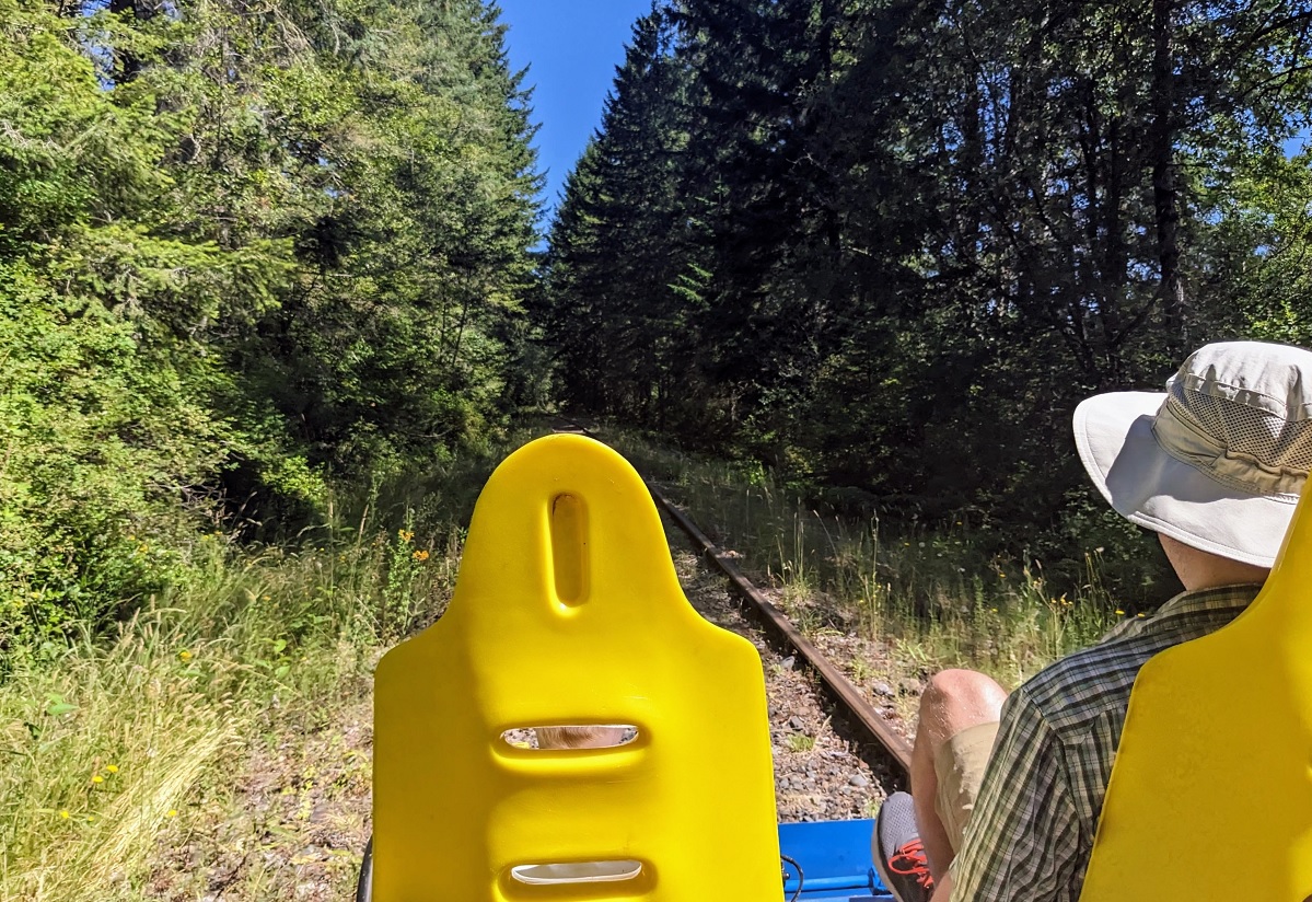 A family pedals their rail car together along the RailCycle Mt. Rainier train bike excursion