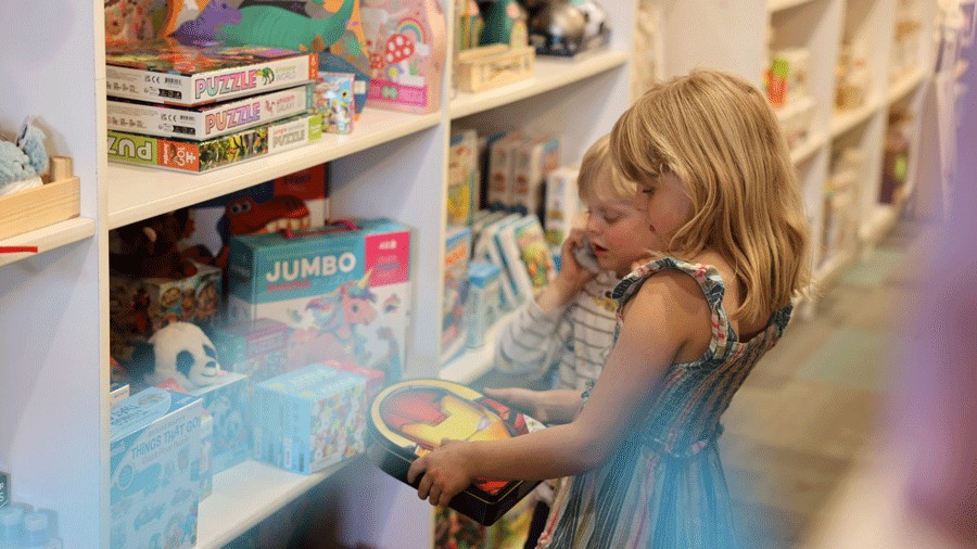 kids looking at toys at a shop in edmonds
