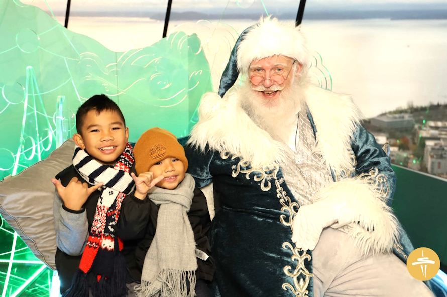 Space Needle Santa with two young boys