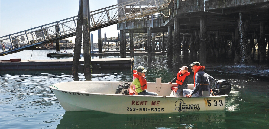 Family in a boat wearing life jackets