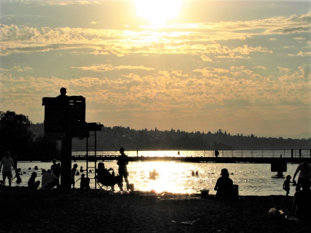 Sunset view of swimming beach at Gene Coulon Memorial Beach Park in Renton near Seattle Puget Sound best swimming lakes