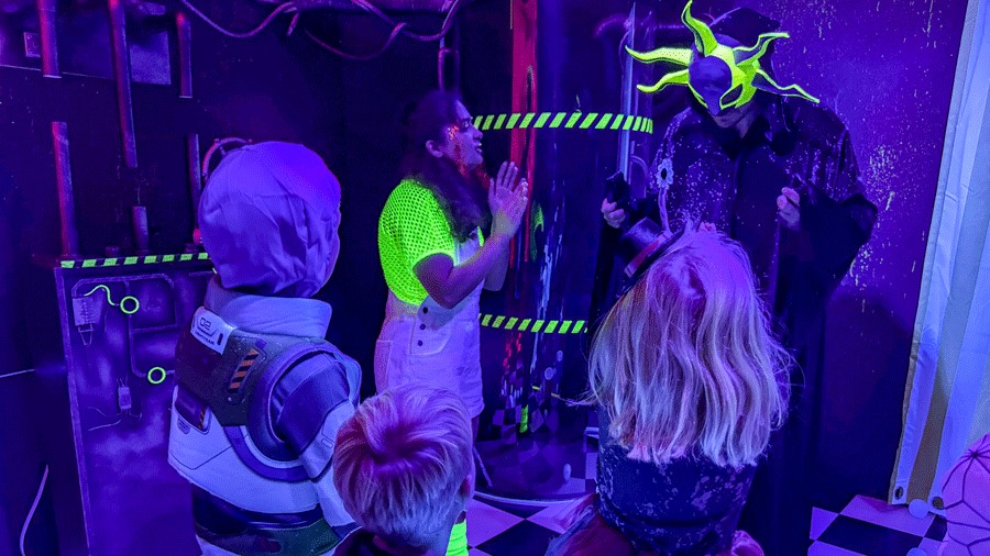Actors performing at Cosmic Carnival, a Seattle experience for families